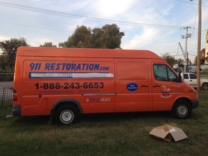 Water Damage Restoration Side Of Van At Dusk