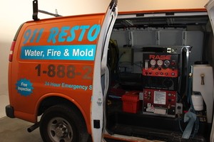 Water Damage Restoration Vacuum Van At Job Location